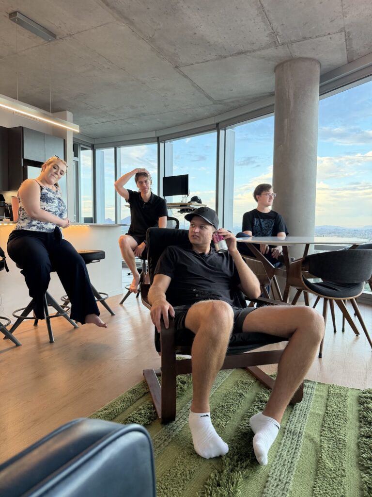 Marko Sipila with the team in a high-rise lounge — June 2026